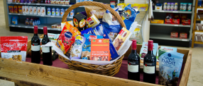 A picture of snacks, wines, and an assortment of other pantry items
